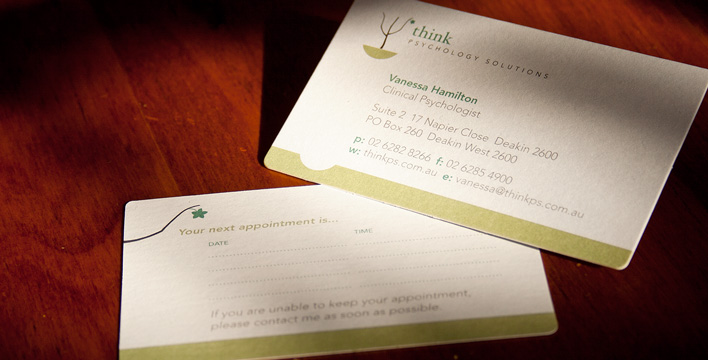 Front and back of the Think Psychology Solutions business card uses soft greens and browns on a smooth, white stock.